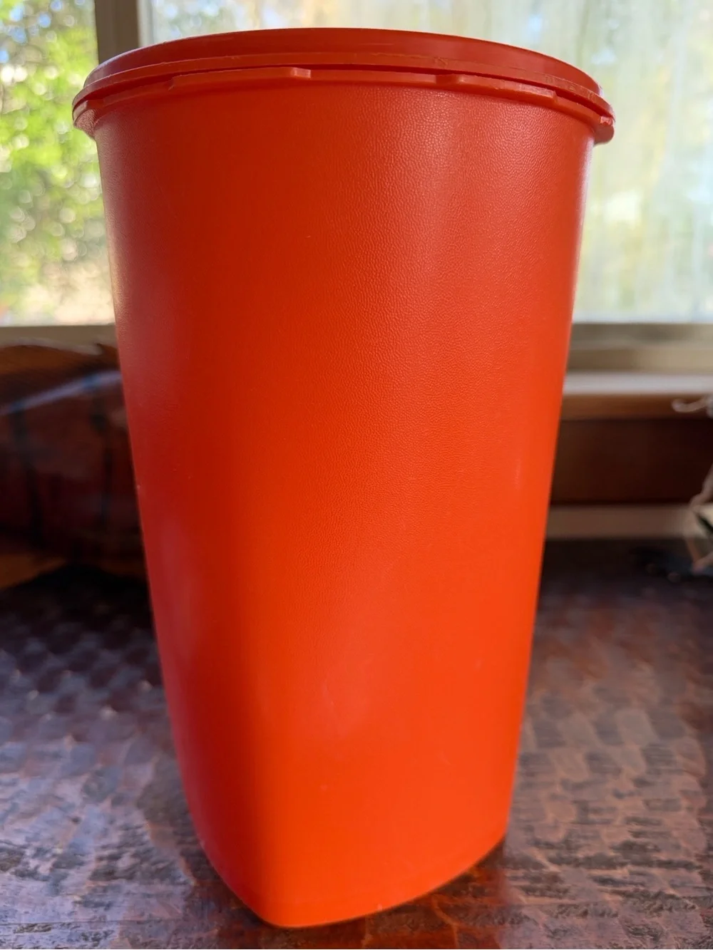 Vintage 1970s Tupperware tangerine orange tall Servalier canister (model #1222)